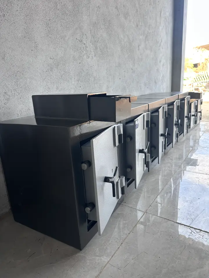 A row of newly made Shellmate drop safes in the workshop