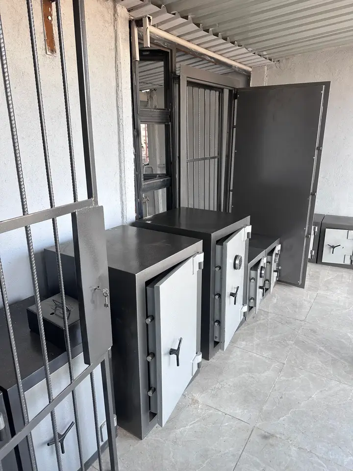 Large Shellmate safes with a heavy steel door standing open behind them