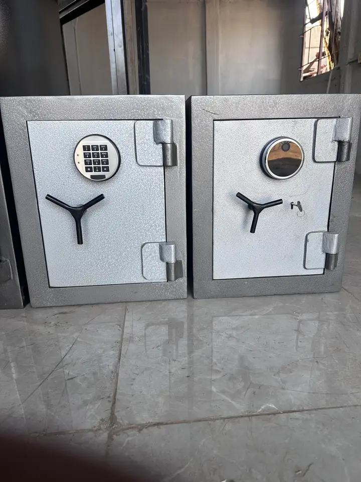 Two closed Shellmate safes with a keypad lock and an electronic lock