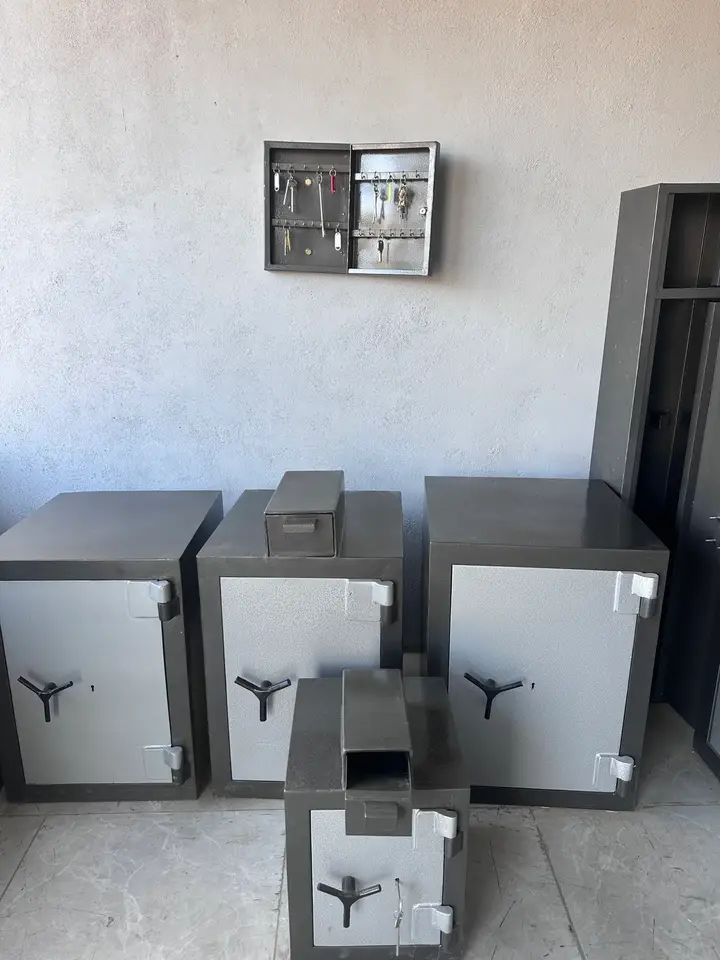 Shellmate safes in several sizes with a wall-mounted steel key cabinet